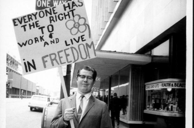 Demonstrator outside the State Steamship Lines, circa May 1969