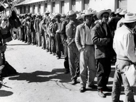 Braceros waiting in line for processing at the Rio Vista Reception Center, El Paso, Texas.