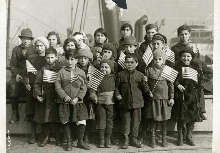 Children holding small American flags